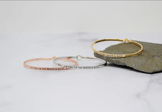 Inspirational motivational bangle bracelets with "I Love You to the Moon and Back" message, perfect for stacking and gifting.