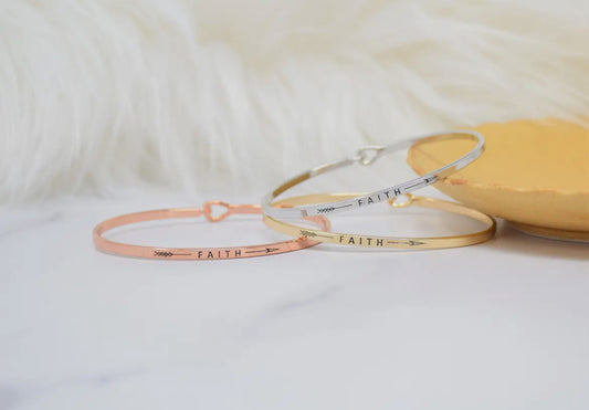 Inspirational Faith bangle bracelets in gold, silver, and rose gold, perfect for stacking and gifting. Elegant motivational jewelry.