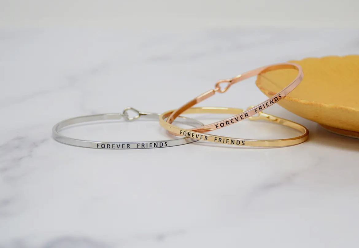 Inspirational Forever Friends bangle bracelets in silver and rose gold, perfect motivational stackable jewelry gifts for friends and loved ones.